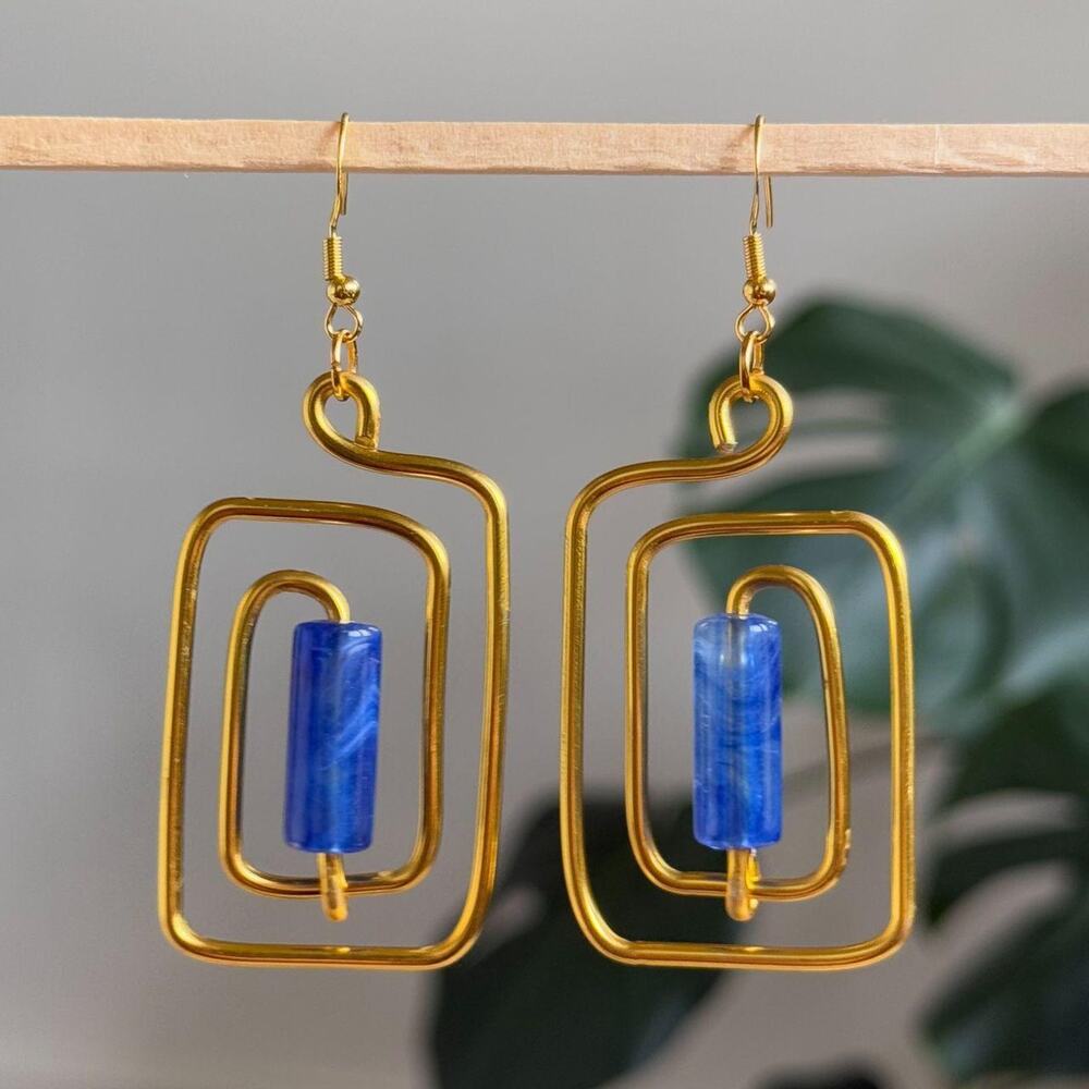 handmade gold wire spiral earrings with royal blue colored tube beads